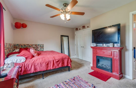 Primary bedroom, ceiling fan, carpet, closet