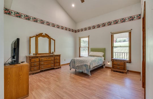 bedroom, vaulted ceiling, recessed lighting, hardwood flooring, windows