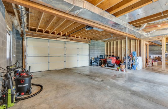 garage, concrete flooring, exterior door, garage door