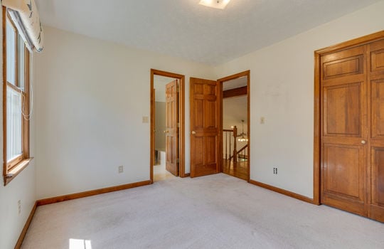 upper level bedroom, doorway to bathroom, carpet, door to loft space