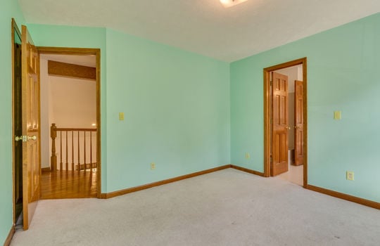 Upper level beddroom, carpet, window, door to bathroom