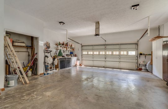 two car garage, concrete floor, garage door