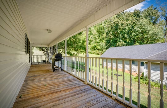 wrap around porch, railing, front yard view