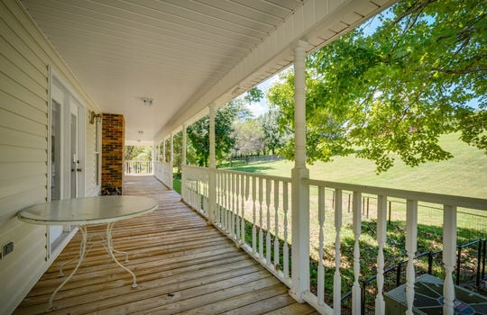 wrap around porch, covered, railing, yard view