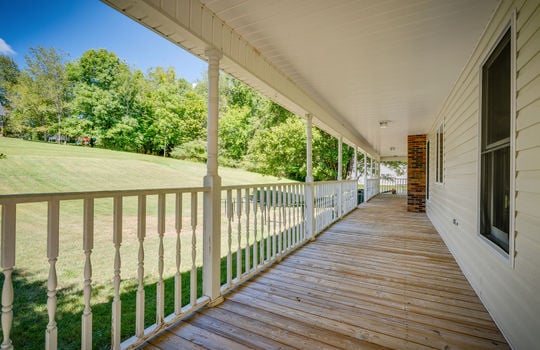 wrap around porch, railing, vinyl siding, covered, yard view