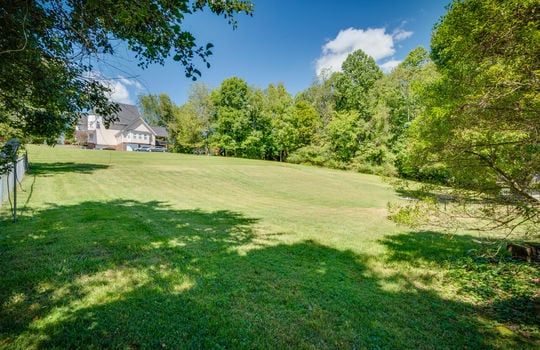 front yard view, trees, two story traditional home