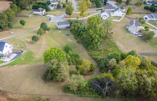 aerial view from back of property, back yard, trees, split level home, neighboring homes