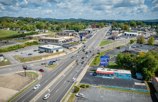 aerial view, restaurant, parking spaces, road, neighboring businesses