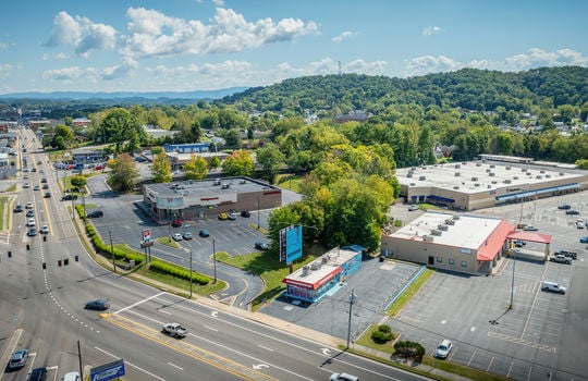 aerial view, restaurant, parking spaces, road, neighboring businesses