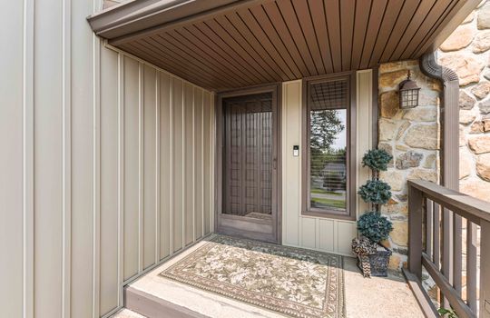 front porch front door, stone, vinyl siding