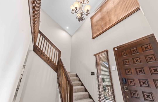 foyer, stairs, chandelier, front door, ground view looking upward