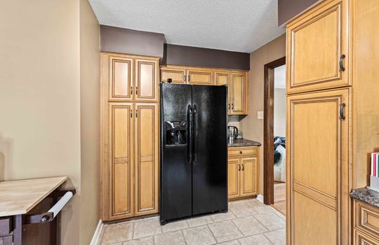 kitchen, tile flooring, refrigerator, cabinets, countertops