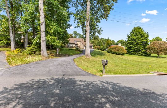 road, driveway, mailbox, trees, front yard, landscaping, 2 story contemporary home