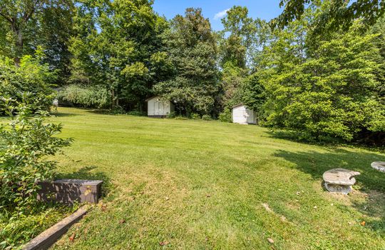 back yard, storage sheds, landscaping trees