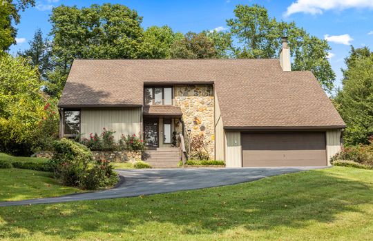 2 story contemporary home, driveway, garage, front door