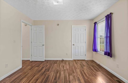 bedroom, closet, laminate flooring, window