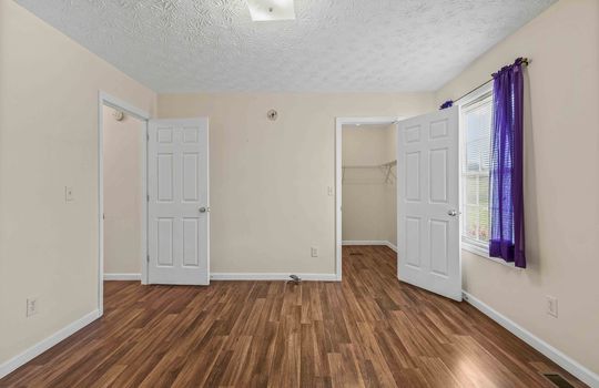 bedroom, closet, laminate flooring, window