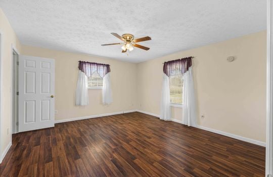 bedroom, laminate flooring, ceiling fan, windows