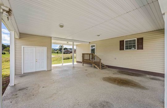 carport, storage space, steps to exterior entrance, concrete, covered carport