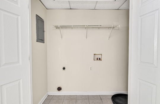 laundry area, tile flooring, wire shelving