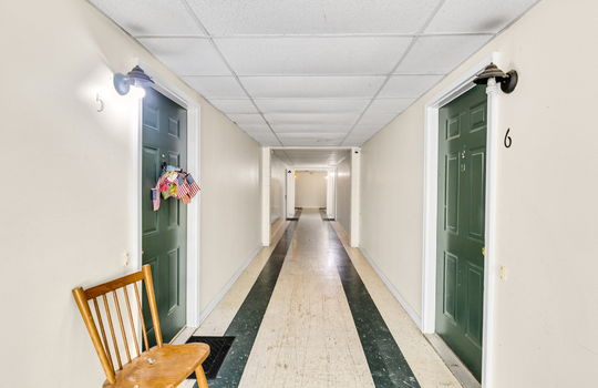 apartment hallway, vinyl flooring, doors to apartments