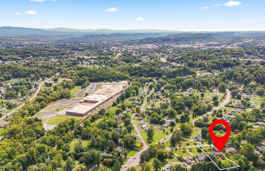 aerial view of home and neighborhood, mountain views, neighboring properties, property outline, property marker