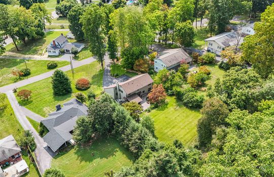 Aerial view, property, front yard, back yard, trees, neighboring homes