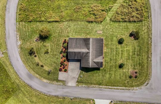 aerial view of home, roof, driveway, road,