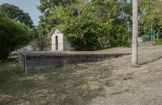 back yard, parking pad, partially fenced