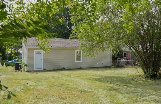 back yard, back of cottage, exterior entry, trees