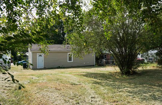 back yard, back of cottage, exterior entry, trees