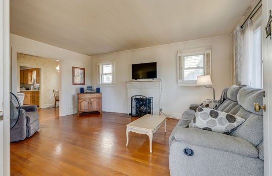 living room, hardwood flooring, windows, fireplace