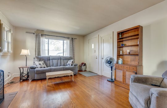 living room, hardwood flooring, picture window, front door