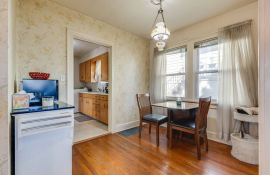 dining space, hardwood flooring, chandelier, windows