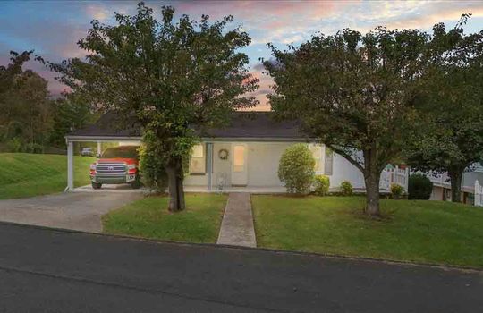 Twilight Photo, Cottage, sidewalk, road, driveway, garage, front door, trees, landscaping