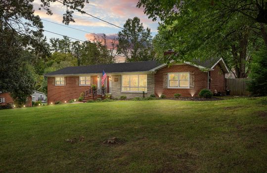 Twilight photo, brick ranch, front yard, trees, landscaping