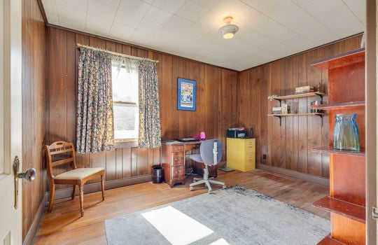 bedroom, paneling walls, hardwood flooring, windows