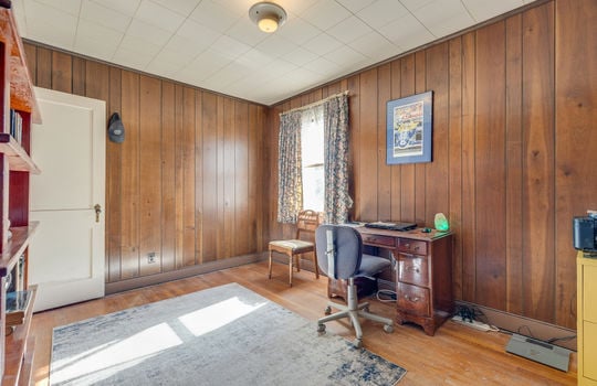 bedroom, hardwood flooring, paneling walls, windows