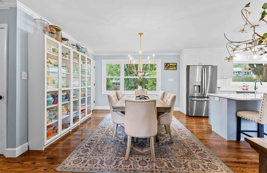 dining area, hardwood flooring, chandelier, window