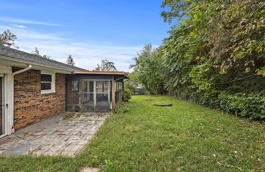 enclosed porch, brick ranch, yard, trees