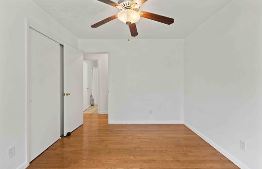 bedroom, closet, hardwood flooring ceiling fan