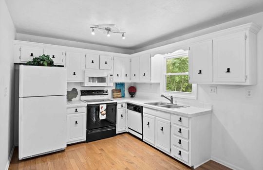 kitchen, cabinets, countertops, oven/range, dishwasher, sink, window above sink, refrigerator