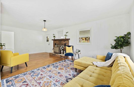 living room, fireplace, hardwood flooring