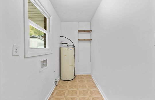 laundry area, vinyl flooring, water heater, washer/dryer hookups