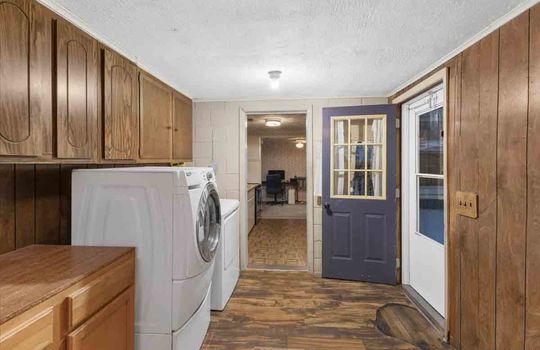 laundry area, exterior door, hardwood flooring