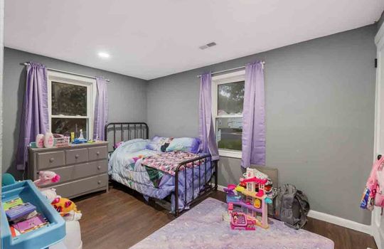 bedroom, laminate flooring, windows, recessed lighting