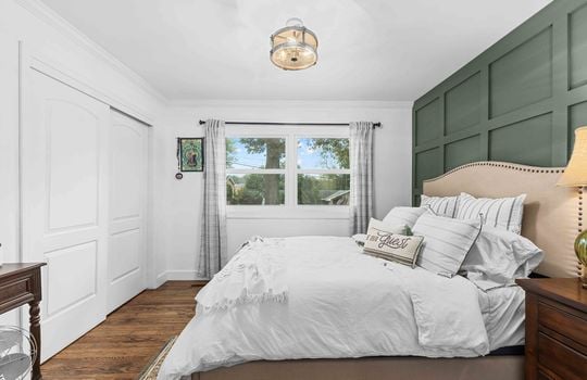 bedroom, board and batten feature wall, window, closet, hardwood flooring