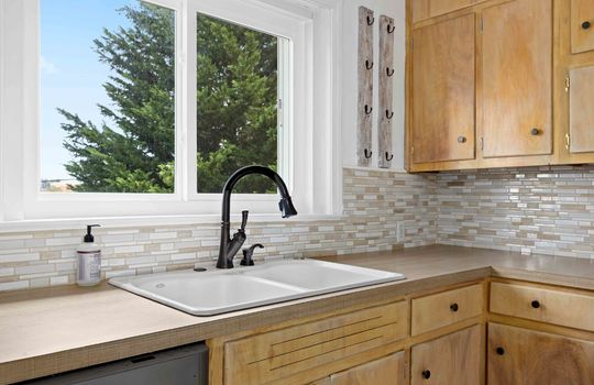 kitchen, dishwasher, cabinets, countertops, sink, window above sink