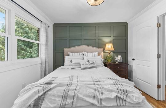 bedroom, board and batten feature wall, window, closet, hardwood flooring