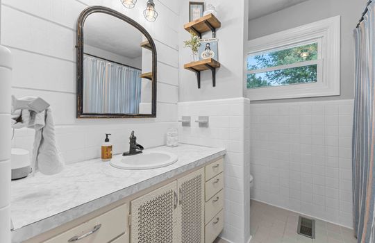 bathroom, sink, tile flooring, shiplap wall feature, window